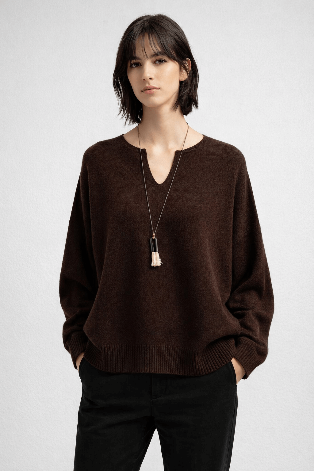 Loose-fitting knitted top with a small slit V-neck